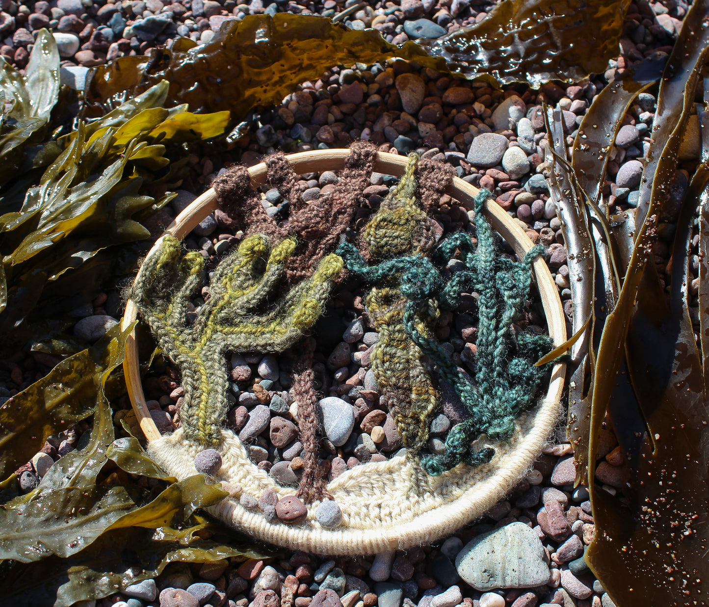 Crochet seaweed mandala at the beach