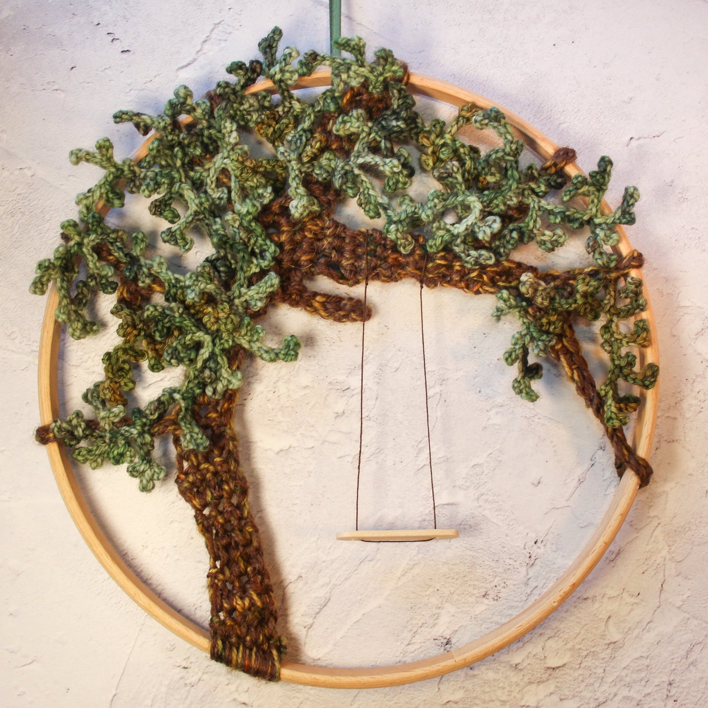 Crochet tree mandala green leaves and a swing hanging from a branch