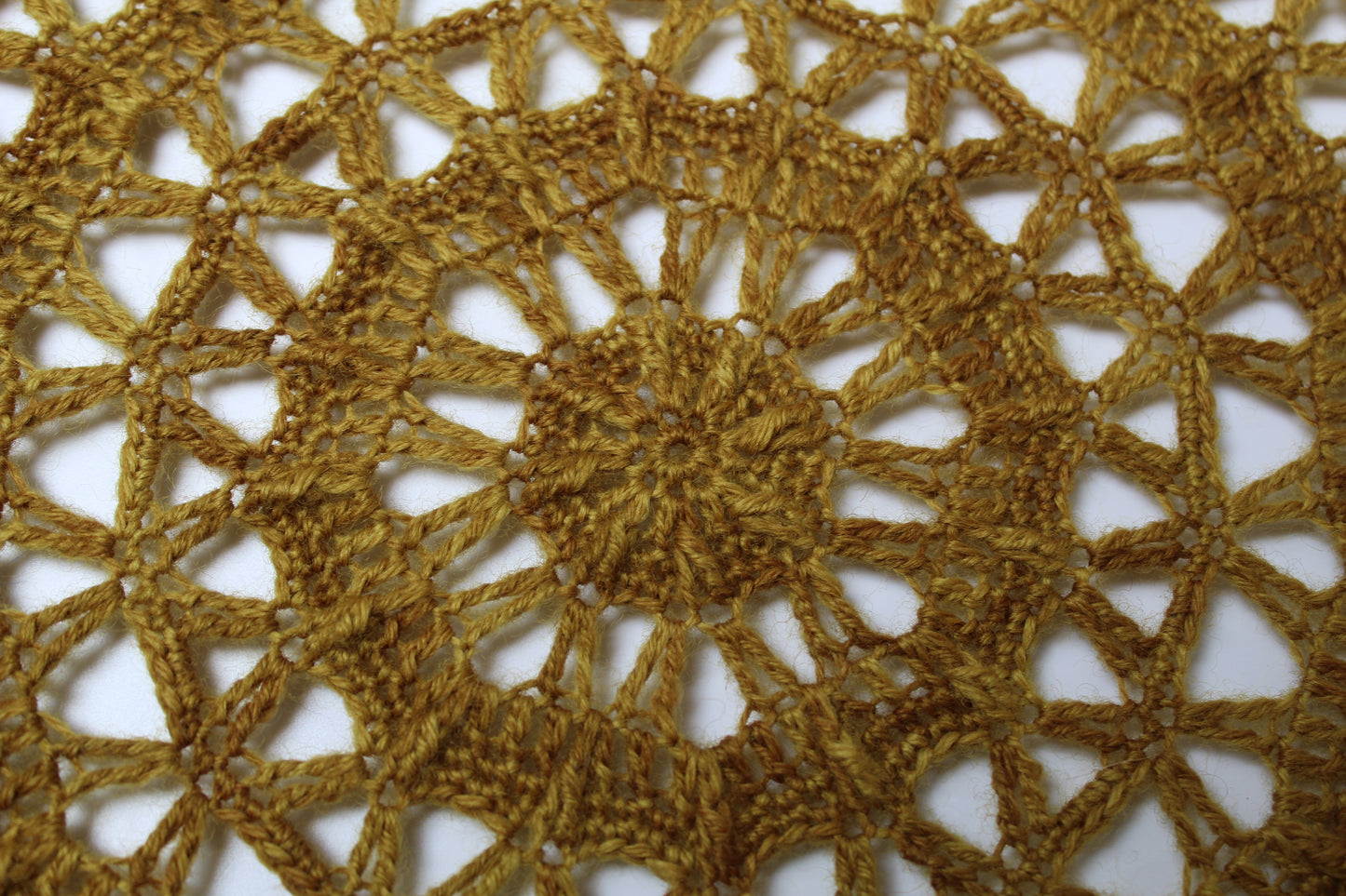 Close up mustard coloured crochet mandala
