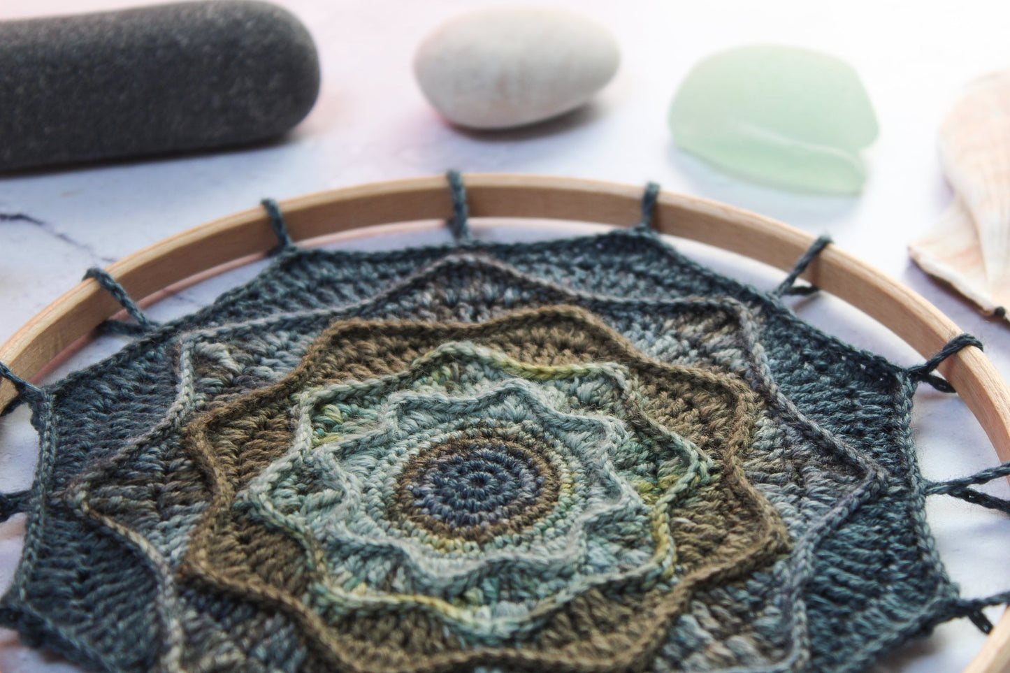 Rought Seas Mandala in blues and greens styled with seaglass and stones