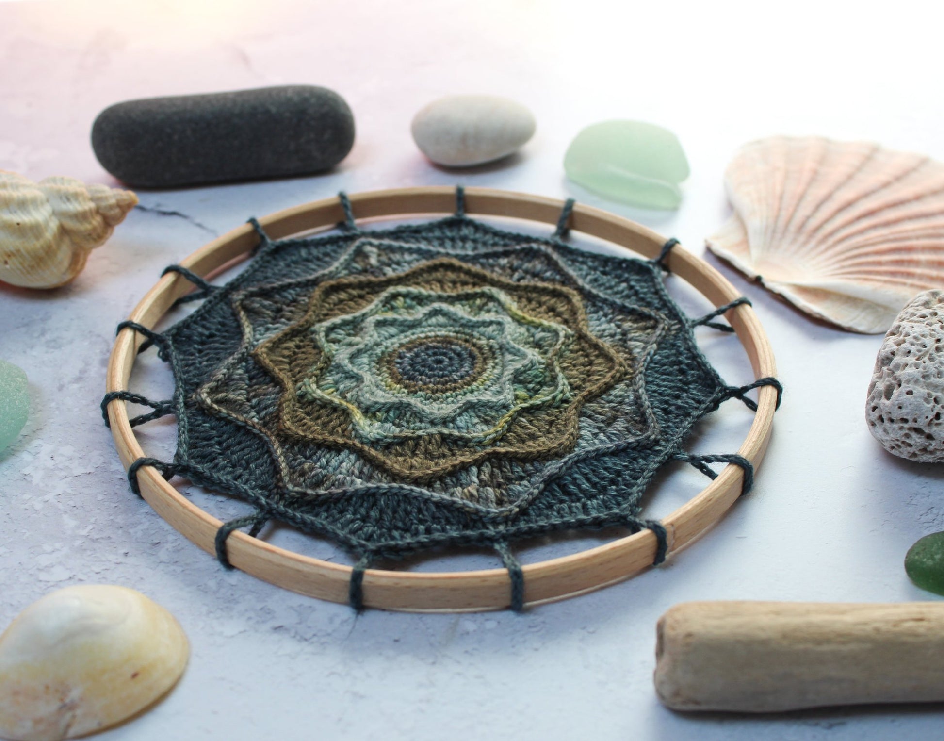 Rought Seas Mandala in blues and greens styled with seaglass and stones