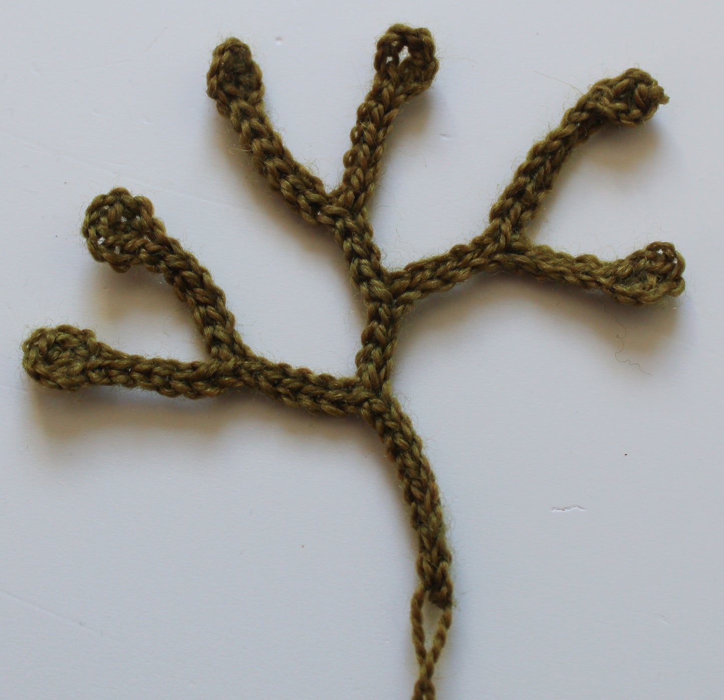 Early progress photo of making seaweed from yarn and crochet
