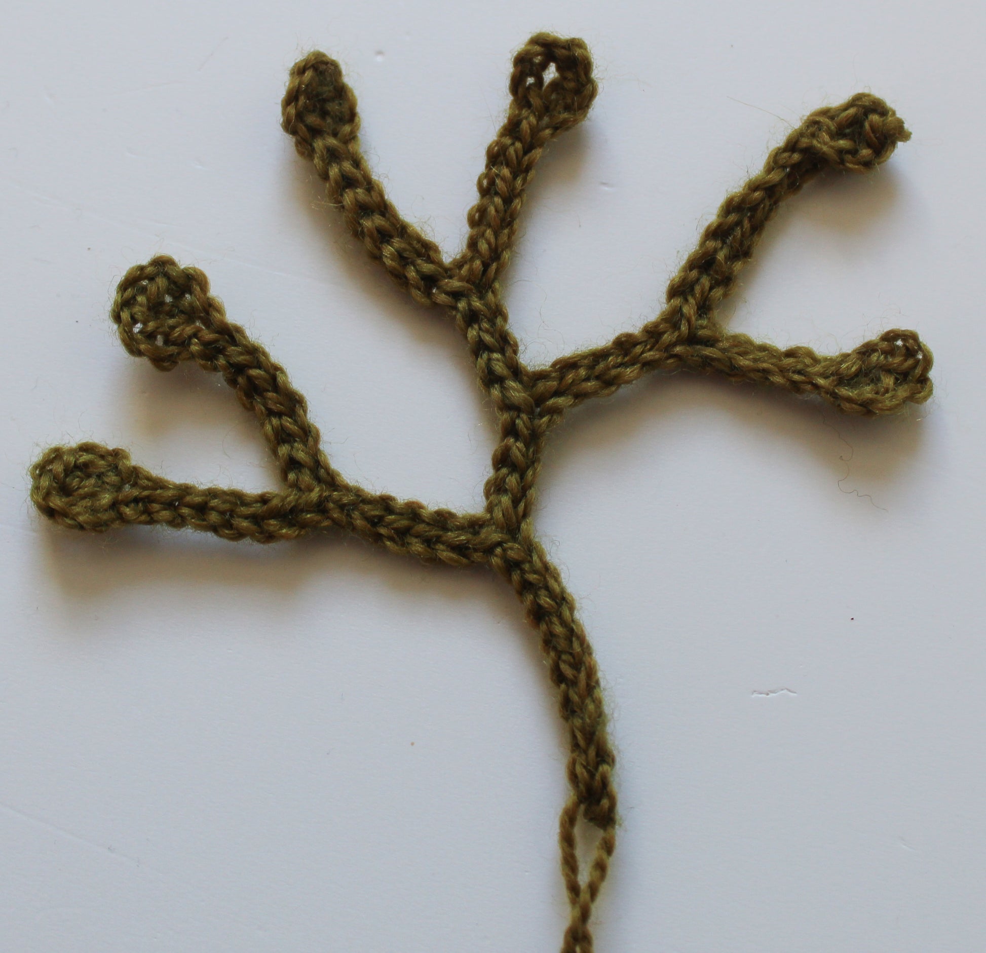 Early progress photo of making seaweed from yarn and crochet