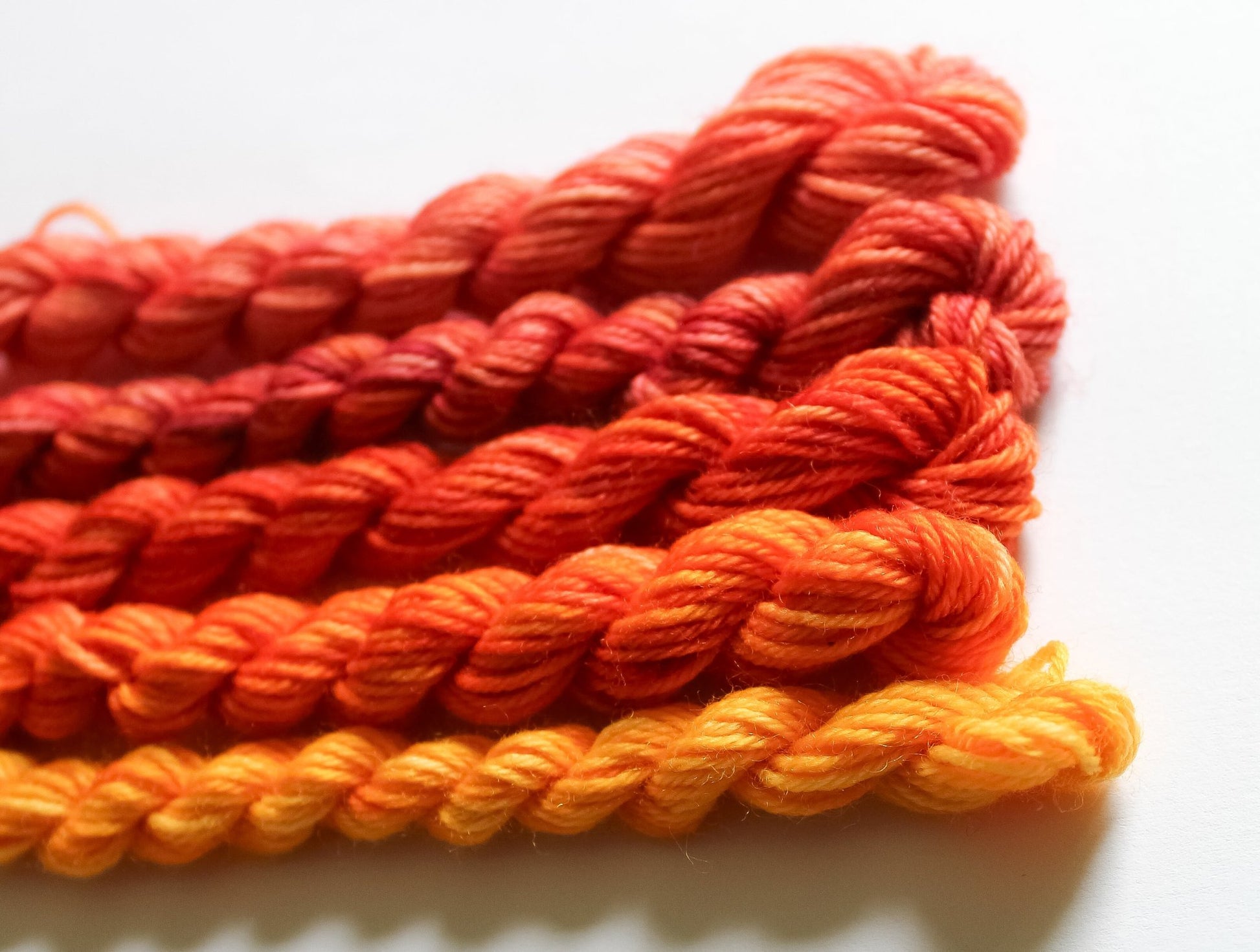 Selection of red, yellow and orange yarns to make Summer Sunset